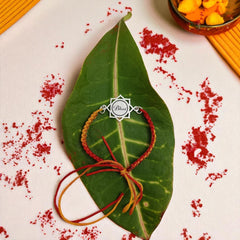 Sterling Silver “Bhai” Engraved Mandala Rakhi – Red-Yellow Thread by Jeluxa