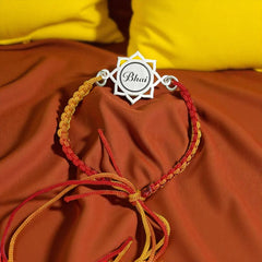 Sterling Silver “Bhai” Engraved Mandala Rakhi – Red-Yellow Thread by Jeluxa